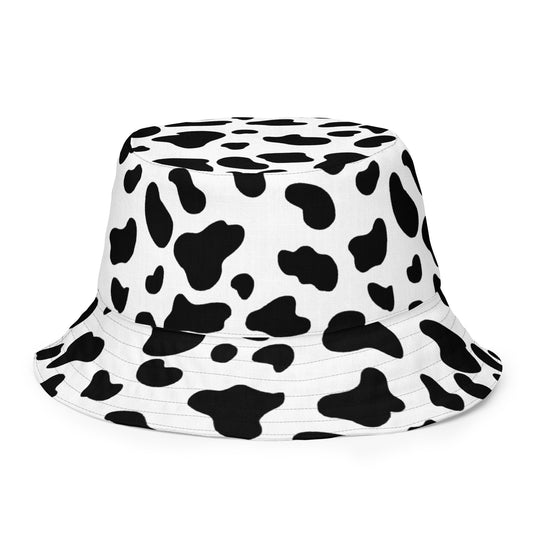 Classic black and white Cow print all over pattern and the reverse side of the hat has a white flower pattern on a black background