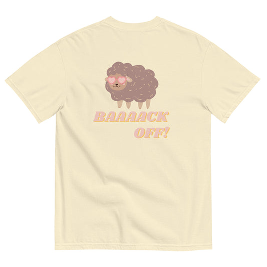Pale yellow shirt with cartoon sheep graphic. The sheep is brown purple with light pink heart sunglasses. And the words back off underneath the sheep. Back spelled with 4 “a”s.