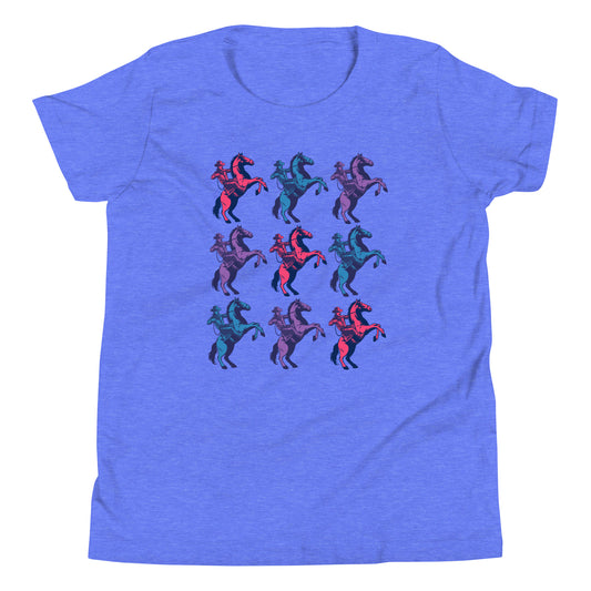 Blue purple shirt With cowboys on rearing horses. Three of them down three of them across alternating in colors. The colors of the cowboy and horses are hot pink, teal blue, and purple.